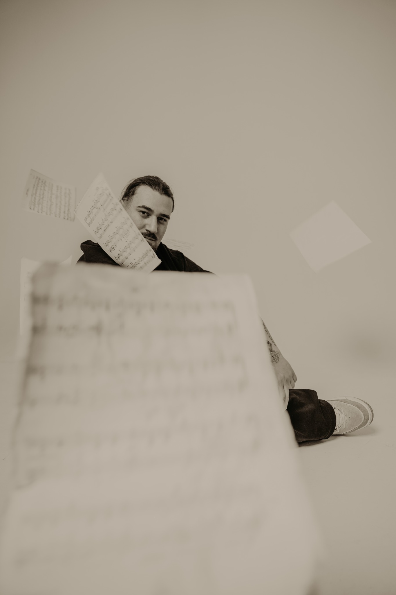 BESSARIONN surrounded by sheet music